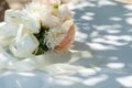 Close-up, selected focus. Wedding bouquet of beautiful brides arranged with roses, gypsophila and a variety of ornamental plants.