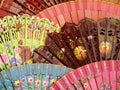 Close up of beautiful, brightly-coloured Spanish fans with intricate floral patterns Royalty Free Stock Photo