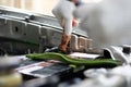 Close up and Selective focus of car mechanic holding battery electricity cables jumper for charging car battery, Services car