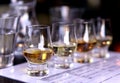 Close-up / selective focus a flight of whiskies. Royalty Free Stock Photo
