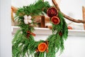 selective focus juniper wreath with dried orange, cinnamon sticks and cotton white background Royalty Free Stock Photo