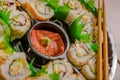 Close up of selective focus of large set of delicious japanese sushi rolls on a black plastic plate Royalty Free Stock Photo