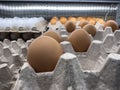 Close up, selective focus on loose eggs for sale inside a grocery store