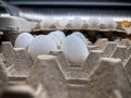 Close up, selective focus on loose eggs for sale inside a grocery store