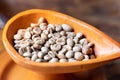 close up selective focus  raw green coffee bean in pottery cup Royalty Free Stock Photo