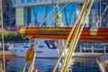 Close up of selective focus of ropes around mast support boom on boat in port of Alesund in Norway