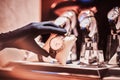 Close-up of the seller`s hand in gloves shows the exclusive men`s watch from the new collection Royalty Free Stock Photo