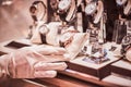 Close-up of the seller`s hand in gloves shows the exclusive men`s watch from the new collection Royalty Free Stock Photo