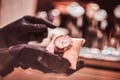 Close-up of the seller`s hands in gloves shows the exclusive men`s watch from the new collection Royalty Free Stock Photo