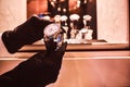 Close-up of the seller`s hands in gloves shows the exclusive men`s watch from the new collection Royalty Free Stock Photo