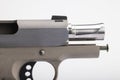 Close up of .45 semi automatic pistol handgun on white background , Gun slide opened