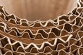 Close-up semicircular wavy layers of corrugated cardboard.