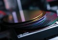 Close-up of semiconductor wafers showcasing intricate patterns and reflections