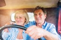 Close up of senior couple inside a pickup truck