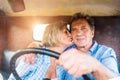 Close up of senior couple inside a pickup truck