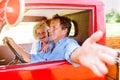 Close up of senior couple inside a pickup truck