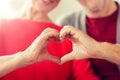 Close up of senior couple showing hand heart sign Royalty Free Stock Photo