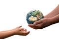 Close up of senior hands giving small planet earth to a child Royalty Free Stock Photo