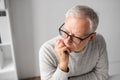 Close up of senior man in glasses thinking Royalty Free Stock Photo