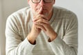 Close up of senior man in glasses thinking Royalty Free Stock Photo