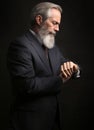 Mature male model wearing suit with grey hairstyle and beard Royalty Free Stock Photo