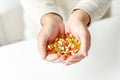 Close up of senior man hands holding pills Royalty Free Stock Photo