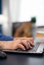 Close up of senior man hands typing Royalty Free Stock Photo