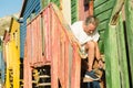 Close up of senior man tying shoelace while sitting on steps Royalty Free Stock Photo