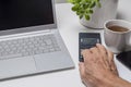 Close-up of senior man using calculator and laptop Royalty Free Stock Photo