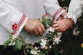 The old couple is holding hands. Close up of senior man and woman holding hands and walking outdoors Royalty Free Stock Photo