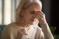 Close up of elderly woman massage eyes suffering from migraine Royalty Free Stock Photo