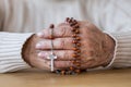 Senior`s hands with red rosary Royalty Free Stock Photo