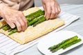 Close up of a senior woman hands stuffing a just baked sponge cake