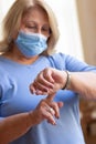 Close-up of senior woman in protective mask at home Royalty Free Stock Photo