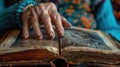 Close-up of a senior womans hand touching a photo album, with visible distress, conveying the emotional impact of Royalty Free Stock Photo