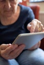 Close Up Of Senior Woman Using Digital Tablet At Home Royalty Free Stock Photo