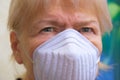 Close up senior woman wearing face mask during corona virus and flu outbreak. Royalty Free Stock Photo