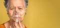 Close-up of a senior woman wearing oxygen mask inhalation undergoing treatment in the hospital. Royalty Free Stock Photo