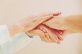 Close up of senior woman and young woman holding hands. Care and support concept Royalty Free Stock Photo