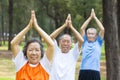 Close-up of seniors doing gymnastics in the park