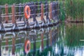 Close up of serene floating boardwalk with orange life preserver