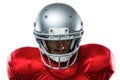 Close-up of serious American football player in red jersey looking down Royalty Free Stock Photo