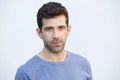 Close up serious caucasian man standing on white background