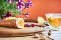 Close up on served cannoli with orange. Italian cuisine pastry. traditional italian dessert with ricotta cheese. Selective focus. Royalty Free Stock Photo