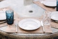 Close up of Served table set at suumer terrace. Cutlery in cafe. Blue glasses Royalty Free Stock Photo