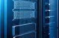 Close up server racks in modern data center neon blue tone background Royalty Free Stock Photo