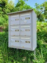 Close up of set of rusty mailboxes in natural environment of the French West Indies. Caribbean postal service. tropical culture