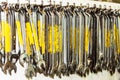 A close-up of a set of spanners neatly hanging side by side on a tool board. Royalty Free Stock Photo