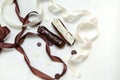 Close-up of a set of two eclairs with different fillings and design isolate on a white surface decorated with chocolate drops, Royalty Free Stock Photo