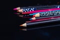 Close up set of various colored cosmetic eyeliner pencils.